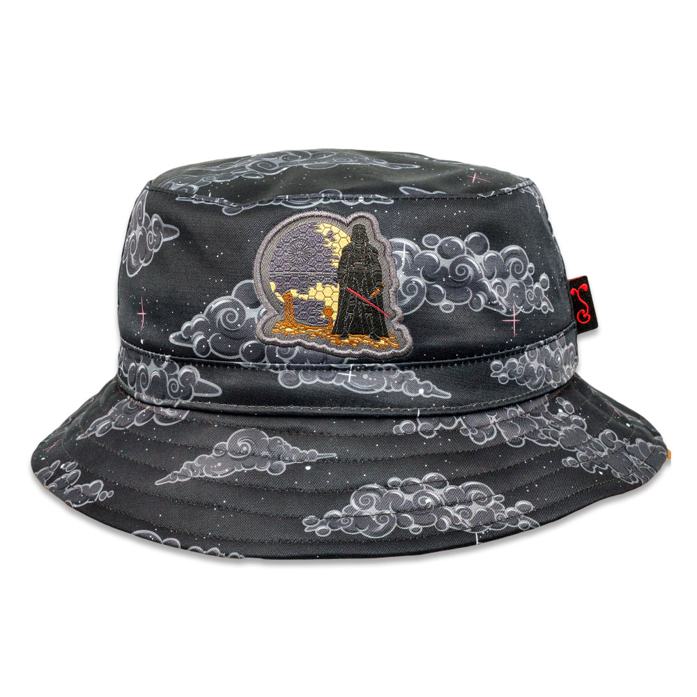 Black reversible bucket hat with cloud pattern and character graphic