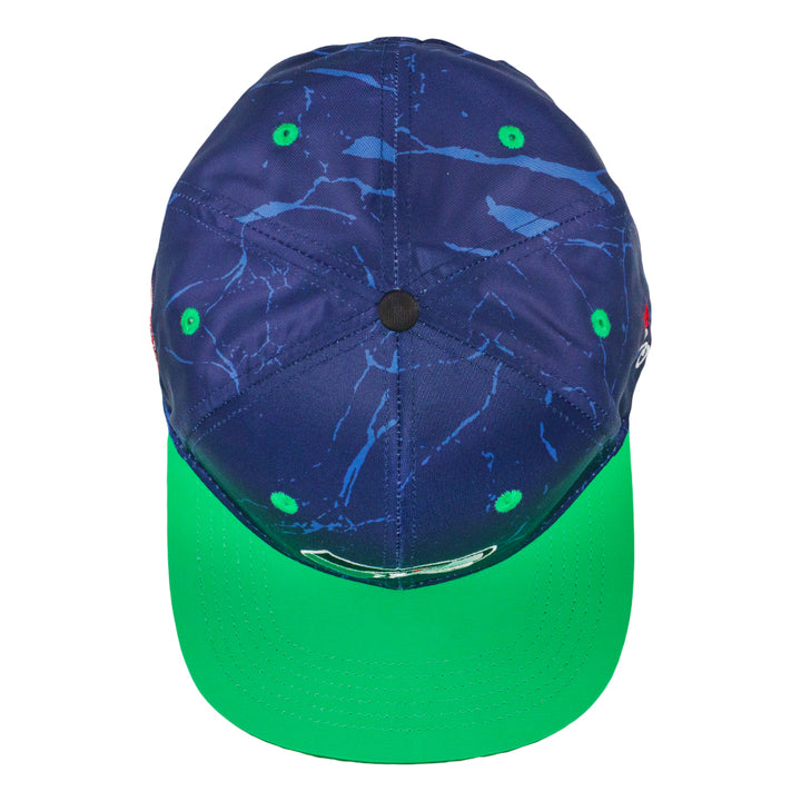 Navy snapback hat with green brim and small green grommets