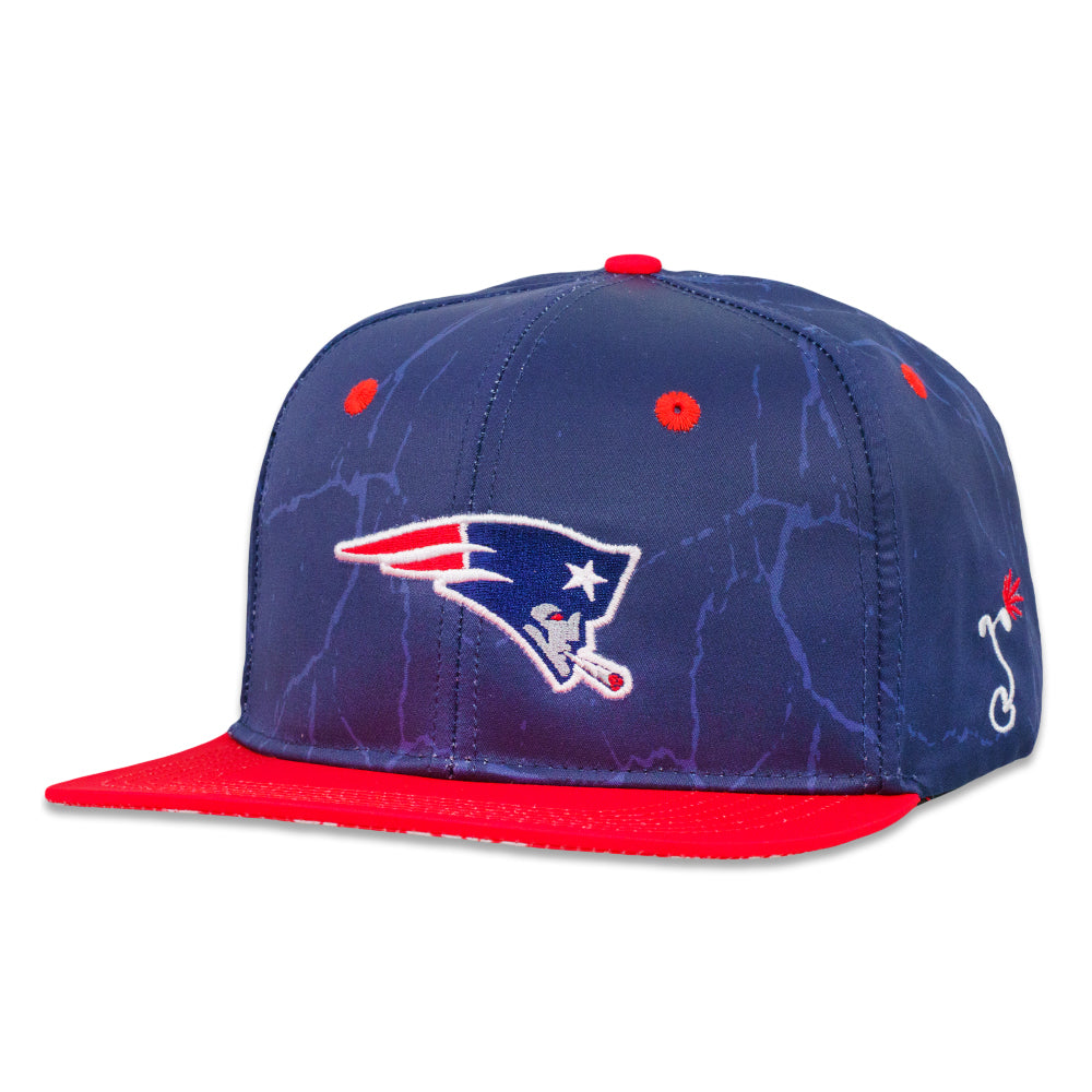 Navy snapback hat with red underside brim and front logo patch