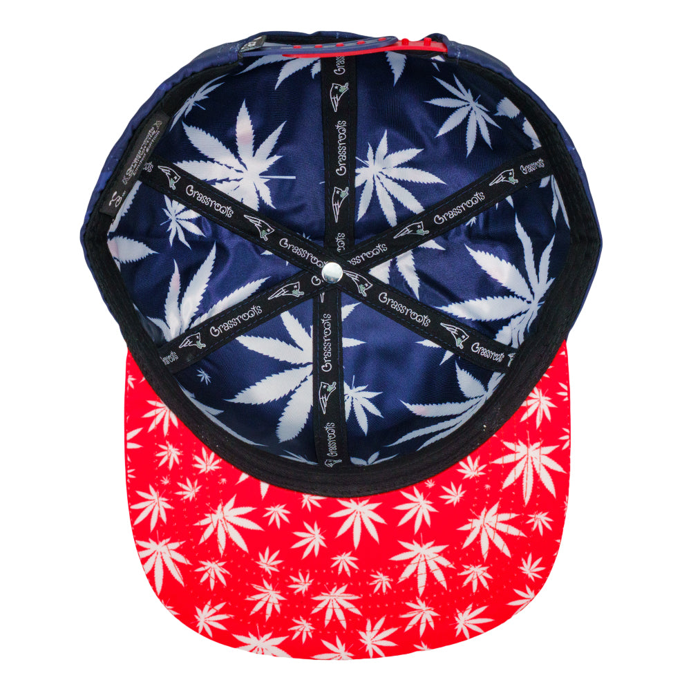Navy and red snapback hat with allover leaf-print panel design