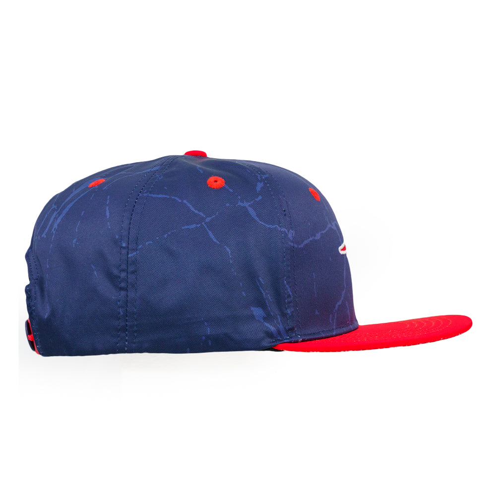 Navy snapback hat with red brim and globe-like pattern stitching on crown