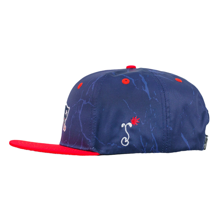 Navy snapback hat with red brim and small red emblem on side