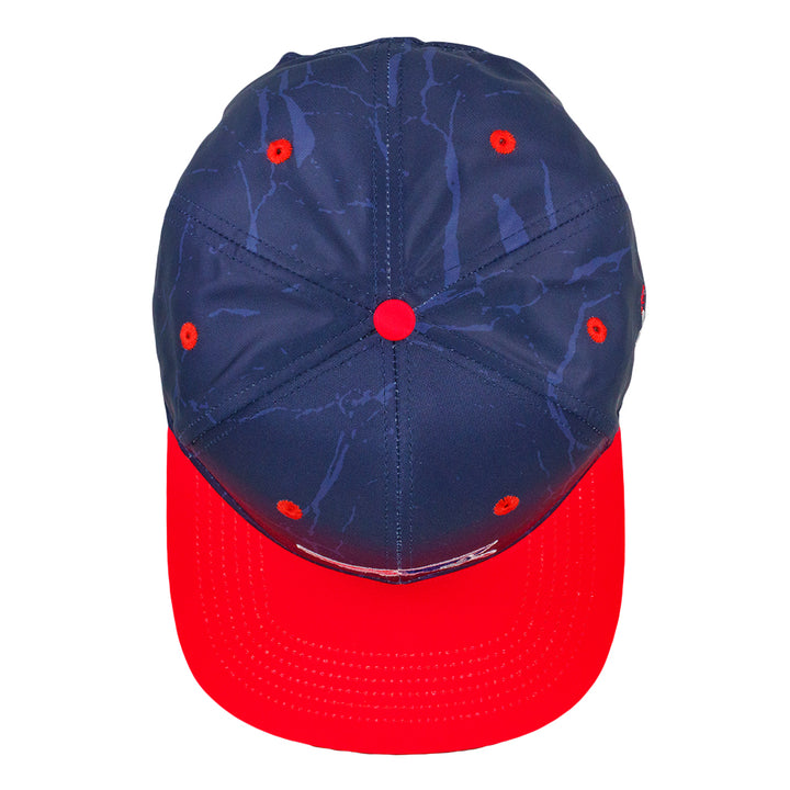 Navy snapback hat top with red center button and red brim band