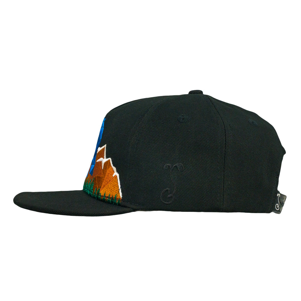 Black snapback hat side profile with partial mountain logo embroidery