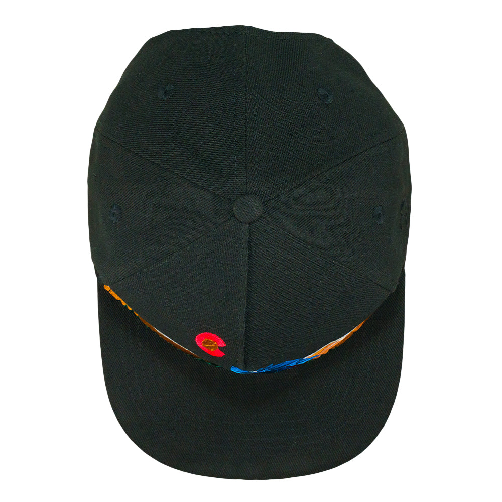 Black snapback hat top view with small geometric accents across brim