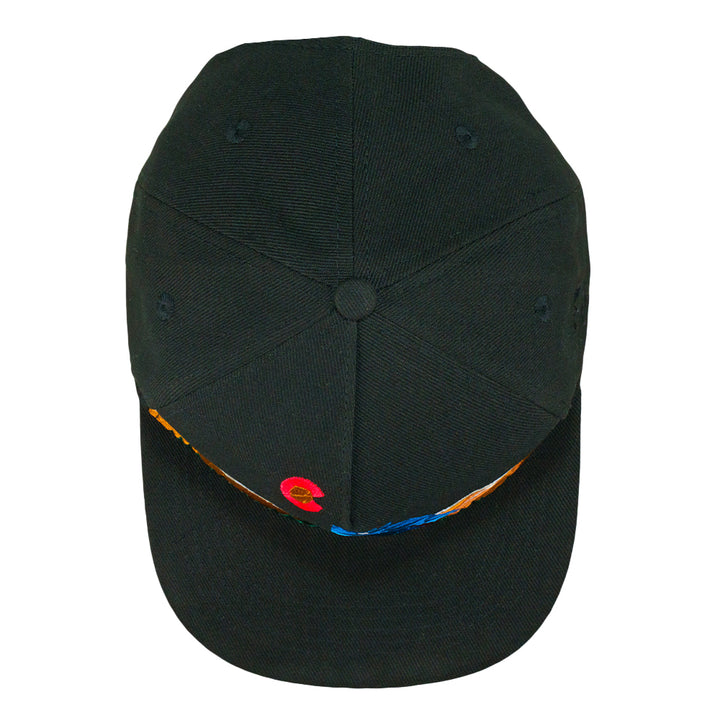 Black snapback hat top view with small geometric accents across brim