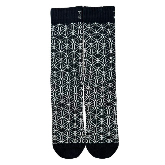 Pair of black crew socks with white geometric grid pattern and ribbed cuffs