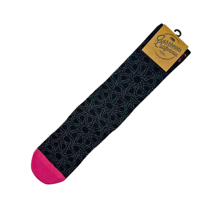 Black dress sock with geometric pattern and bright pink toe accent