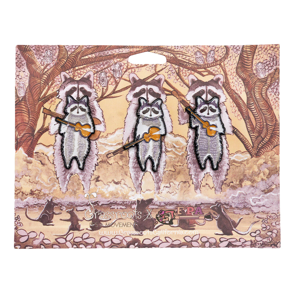 Set of three raccoon band enamel pins on card, multi-color details