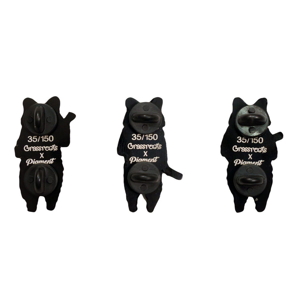 Three raccoon pin backs in black, numbered 35/150 with clasp