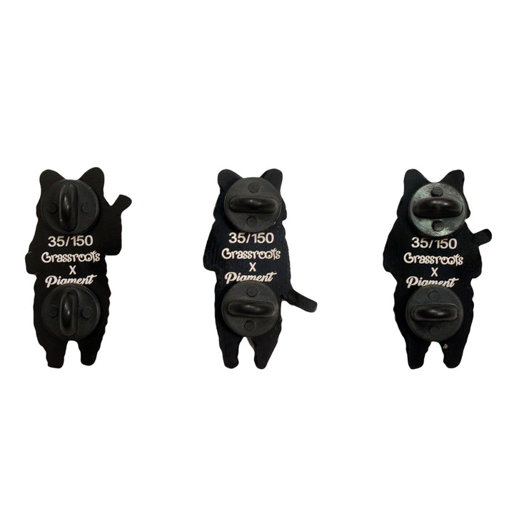Three raccoon pin backs in black, numbered 35/150 with clasp