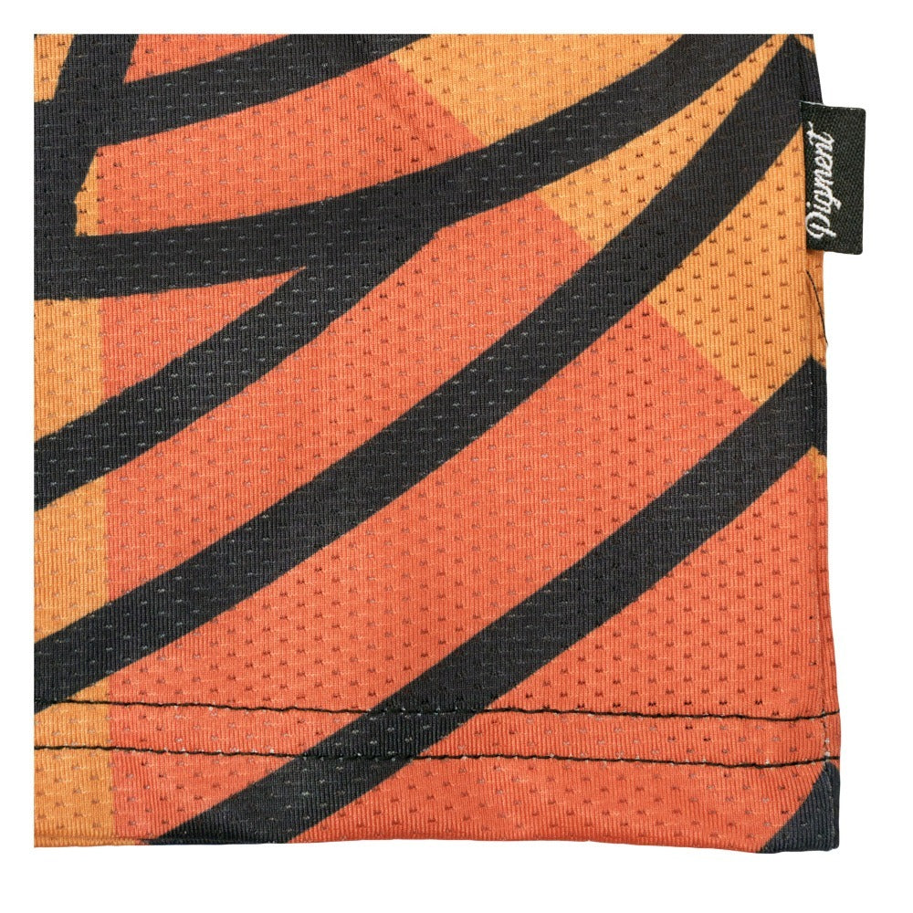 Multi-color T-shirt hem corner with orange and black striped geometric print