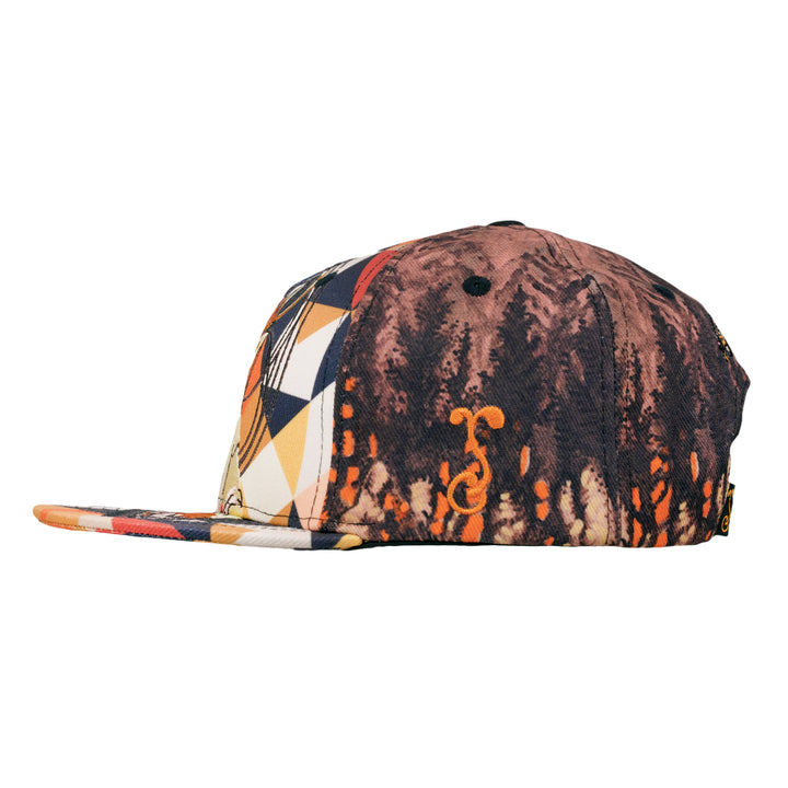 Snapback hat side with orange and cream geometric blocks over dark marbled red fabric.