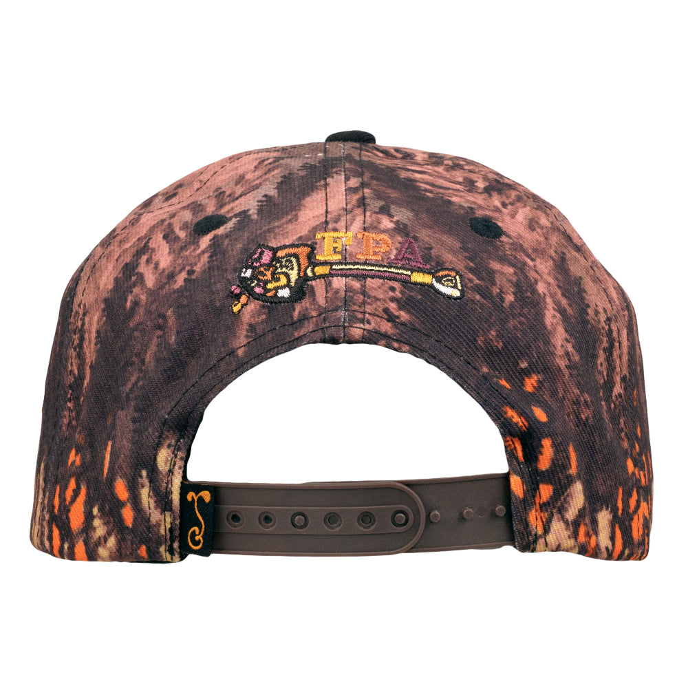 Snapback hat back view with dark marbled print and embroidered colorful crest near top.