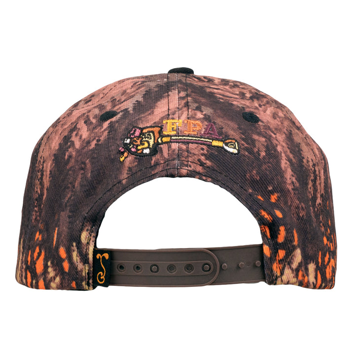 Snapback hat back view with dark marbled print and embroidered colorful crest near top.