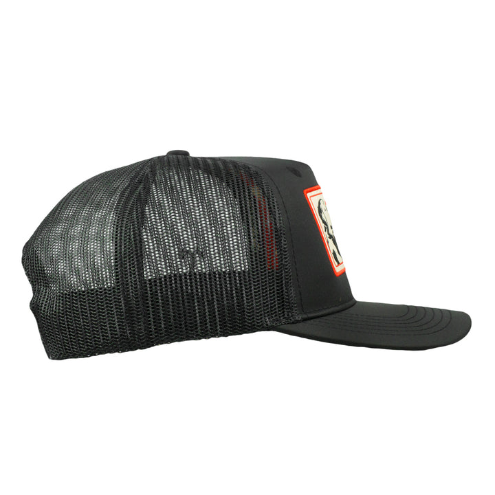 Black mesh snapback hat, side view with small orange-edged logo patch