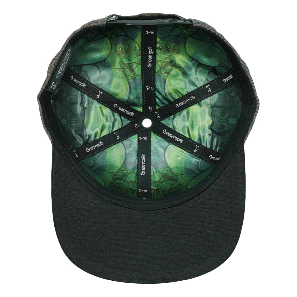 Gray snapback hat with black crown and green camo-style inner lining