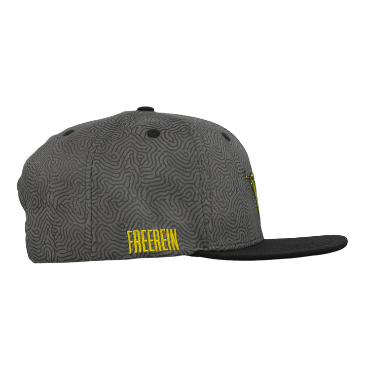 Gray snapback hat with black brim and yellow “FREE REIN” side text