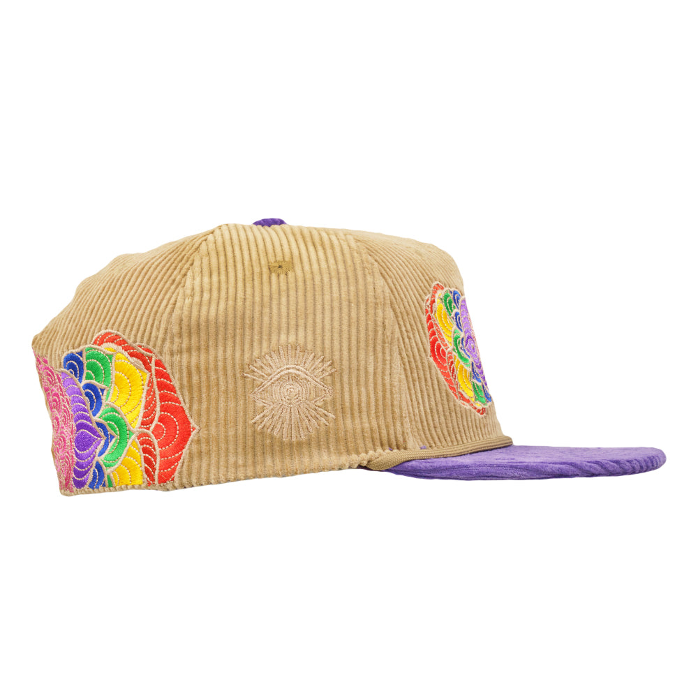 Tan corduroy snapback with purple brim and side rainbow flower embroidery patch