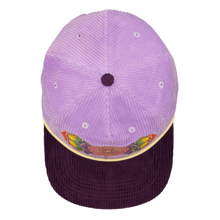 Purple corduroy snapback hat top view with vent eyelets and dark brim