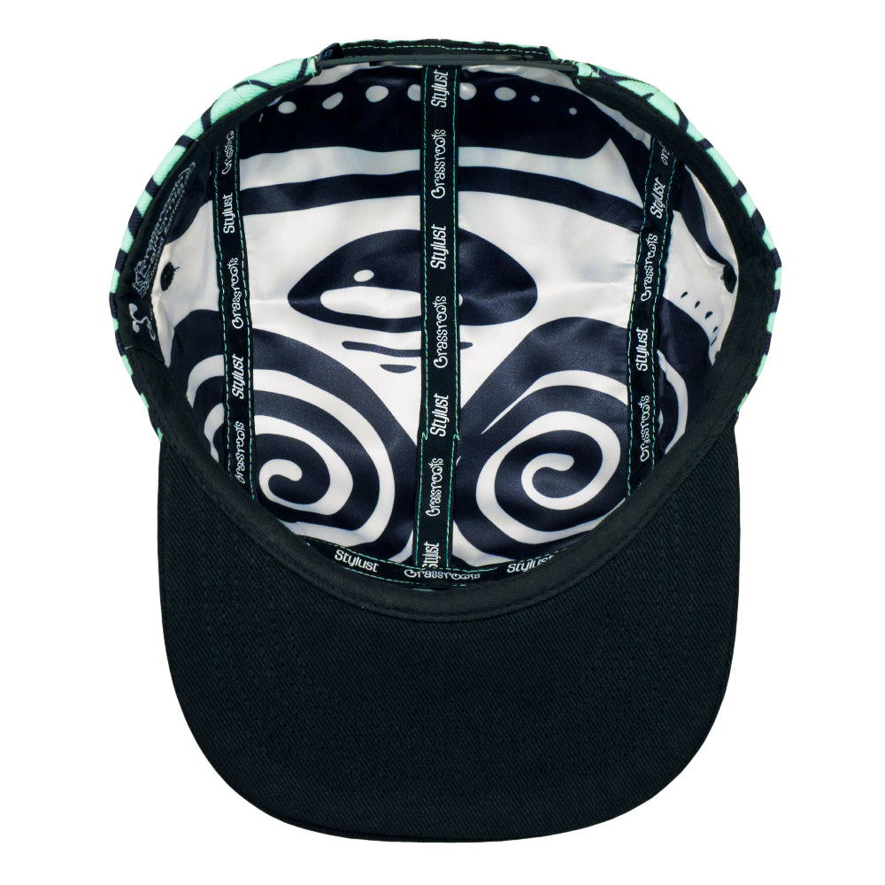 Inside view of black snapback hat with seafoam lining and adjustable strap