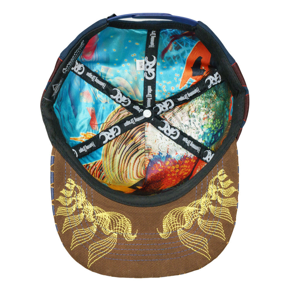 Navy snapback cap interior with colorful dragon print and adjustable strap
