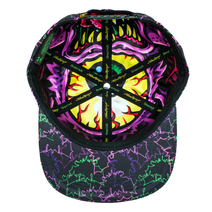 Black snapback hat, top view with neon purple, green, and yellow face graphic