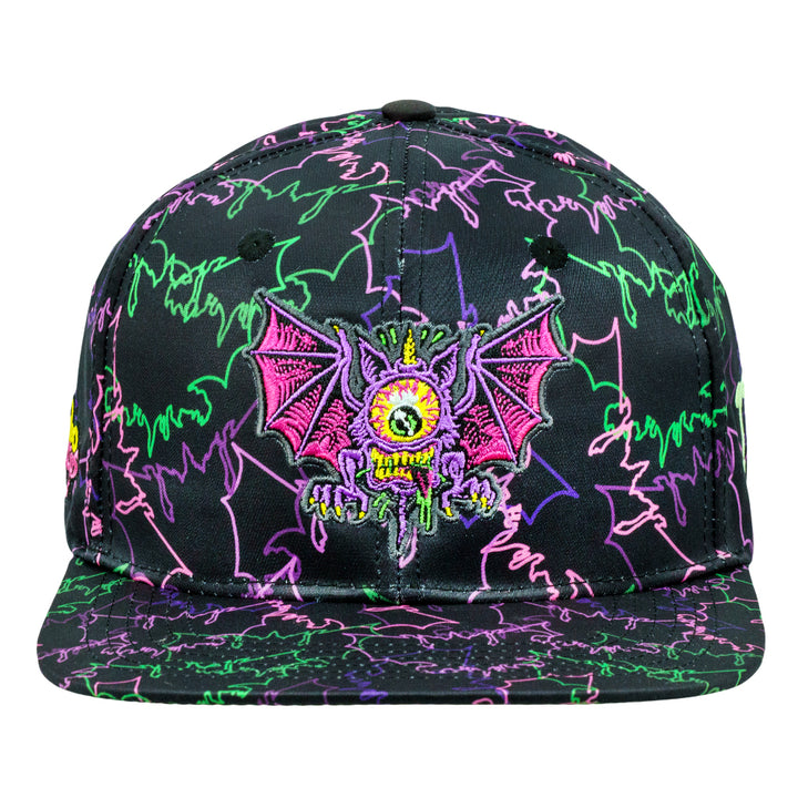 Black snapback hat front close-up: neon graffiti with embroidered purple monster patch