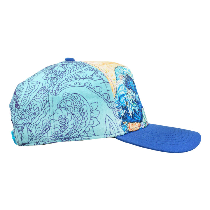 Side view of snapback hat with blue patterned panels, a Great Wave print, and blue brim